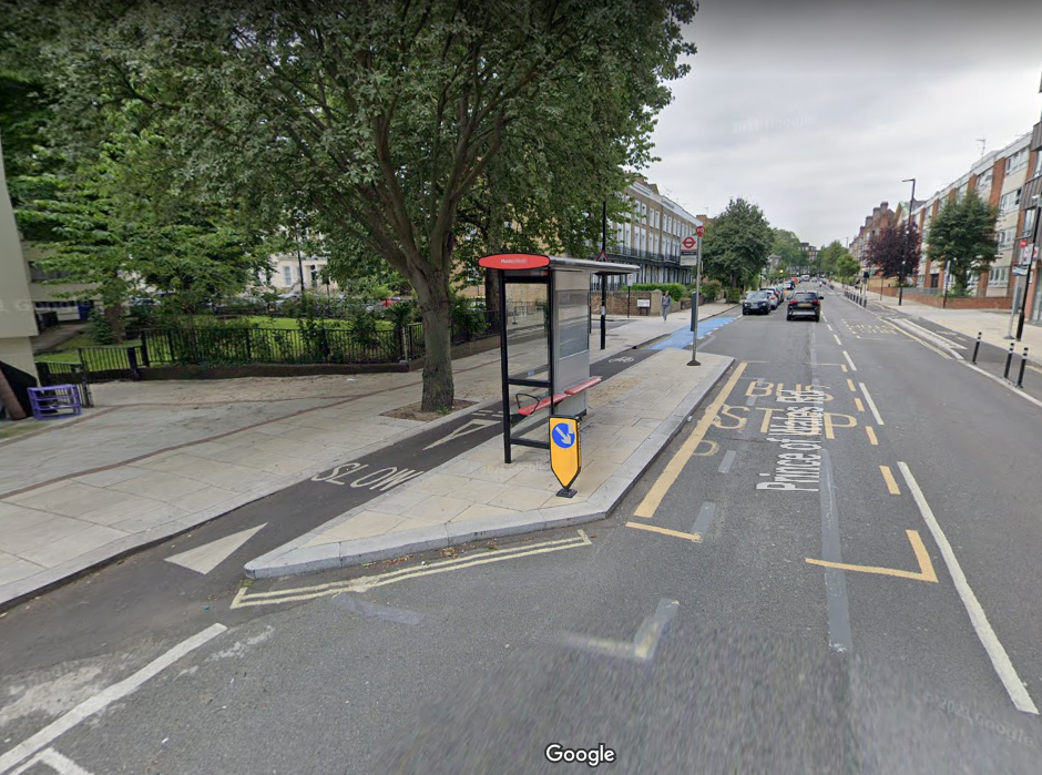 a bus stop boarder with cycle lane and a continuous footway at a road junction